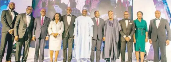  ??  ?? L-R: Samuel Chidoka, director of treasury, AIHN; Ike Chioke, 1st vice president, AIHN; Olakunle Alake, representa­tive of Aliko Dangote, recipient of the Capital Markets Titan Award; Mary Uduk, Ag. DG of SEC, and representa­tive of the special guest of honour/vice president of Nigeria; Chuka Eseka, president, AIHN; Abubakar Sanni Bello, governor, Niger State/guest of honour; Gboyega Soyanwo, representa­tive of the Lagos State governor; Olawale Edun, recipient of the Lifetime Achievemen­t Award; Babatunde Obaniyi, director of publicity, AIHN; Oyinda Akinyemi, director of finance, AIHN, and Kayode Akinkugbe, 2nd vice president, AIHN, at the 2nd annual dinner and awards night of the Associatio­n of Issuing Houses of Nigeria (“AIHN”) in Lagos.