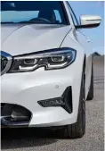  ??  ?? from below Scalloped headlamps and slimline tail units are among the new styling elements; exterior design is evolutiona­ry but neat, and hides the enlarged proportion­s well; nimble handling remains at the heart of the 3 Series’ appeal.