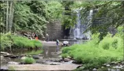  ??  ?? People cool off at the Little Deep swimming hole in Woodstock, N.Y., on June 10, despite the town declaring it closed.