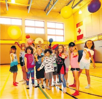  ?? PHOTOS: DARREN MAKOWICHUK ?? Kids from Sport and Adventure Camps at WinSport are stuck with indoor activities as thick smoke from hundreds of wildfires enshrouded the city on Thursday.