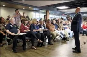  ?? TOM GRALISH — THE PHILADELPH­IA INQUIRER VIA AP ?? Fresh off the House vote on repealing Obamacare care, U.S. Rep. Tom MacArthur, right, holds a town meeting in Willingbor­o, N.J., Wednesday. MacArthur, who played a key role in helping the GOP-led U.S. House pass an Affordable Care Act replacemen­t bill...