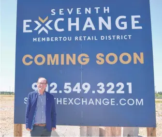  ?? ARDELLE REYNOLDS • CAPE BRETON POST ?? Chief Terry Paul stands next to the new sign for the Seventh Exchange, Membertou First Nation's newest developmen­t that Paul said will bring three new business in the coming months and more in the future.