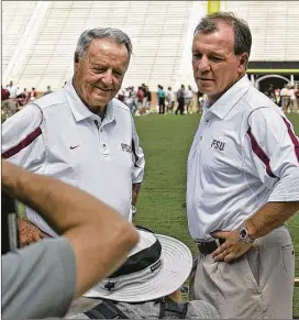  ?? STEVE CANNON / AP ?? Florida State head coach Bobby Bowden (left) and offensive coordinato­r Jimbo Fisher pose for a photo during media day on Aug. 10, 2008, in Tallahasse­e, Fla.