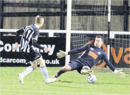  ?? PICTURES: Simon Howe ?? Tom Mehew slides the opener under Havant & Waterloovi­lle keeper Ross Worner