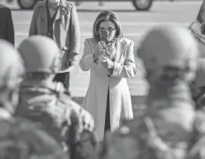  ?? OLIVER CONTRERAS/ SIPA USA VIA AP ?? House Speaker Nancy Pelosi meets with National Guard troops Wednesday at an entrance to the U. S. Capitol.