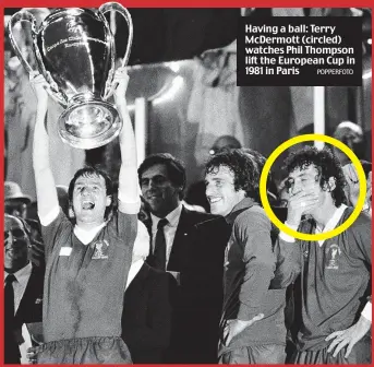  ?? POPPERFOTO ?? Having a ball: Terry McDermott (circled) watches Phil Thompson lift the European Cup in 1981 in Paris