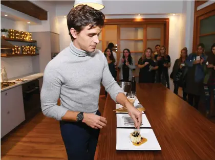  ?? DAVE KOTINSKY/GETTY IMAGES ?? “When you start cooking … you realize that you become knowledgea­ble in the kitchen pretty quickly,” Antoni Porowski writes in Queer Eye: Love Yourself, Love Your Life.