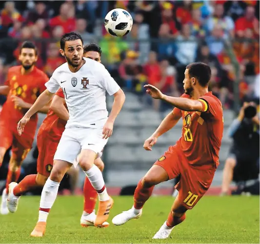  ?? PHOTO AFP ?? Un match de préparatio­n sans histoire entre le Portugal et la Belgique, hier, au stade Roi Baudouin à Bruxelles.