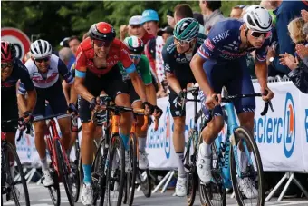  ?? Getty iMages ?? BONNE CHANCE: Team Alpecin Fenix’ Mathieu van der Poel of the Netherland­s, right, leads the pack during the second stage of the 108th Tour de France on Sunday.