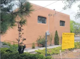  ?? DEAN HANSON/JOURNAL ?? A sign of last month’s neighborho­od meeting on renewed operation of a Seventhday Adventist school sits in front of one of the buildings that would be used.