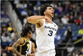  ?? CHRIS CARLSON / AP ?? Xavier’s Colby Jones celebrates after scoring Sunday against Pitt in an NCAA tournament game in Greensboro, N.C. Five of the 10 best 3-point shooting teams in the country made the tourney but just two are left: Xavier and Michigan State.