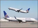  ??  ?? In this file photo, a United Airlines airplane takes off over a plane on the runway at San Francisco Internatio­nal Airport in San Francisco. (AP)