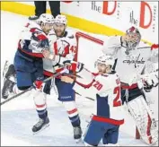  ?? Ross D. Franklin Associated Press ?? THE CAPITALS CELEBRATE after rallying in the final 10 minutes to defeat the Golden Knights.