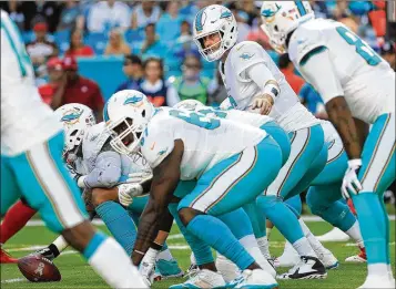  ?? MIKE EHRMANN / GETTY IMAGES ?? Turnovers have been another problem for the Dolphins, along with penalties. Jay Cutler threw three intercepti­ons on the team’s first four possession­s against the Buccaneers on Sunday.