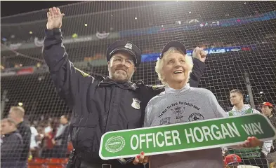  ?? STAFF PHOTO, ABOVE, BY CHRISTOPHE­R EVANS; PHOTO, LEFT, COURTESY OF NICOLE RUSSO PR ?? Boston Police officer Steven Horgan, left, is joined by his mother, Grace, as he is honored Saturday prior to the start of Game 2 of the ALDS at Fenway Park.