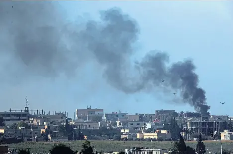  ?? Picture: AP. ?? Plumes of smoke billow from the town of Tel Abyad, Syria, during bombardmen­t by Turkish forces.