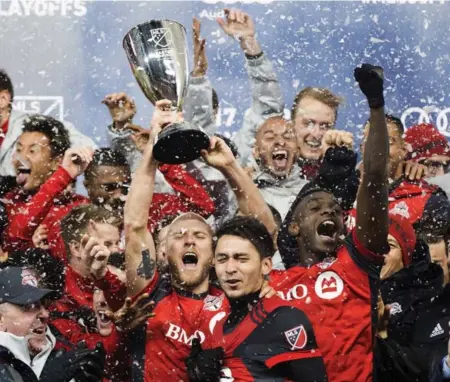  ?? NATHAN DENETTE/THE CANADIAN PRESS FILE PHOTO ?? Hoisting the Eastern Conference trophy marked a major achievemen­t for captain Michael Bradley and Toronto FC, which expected nothing less than a second straight trip to the MLS Cup final. “This was all we wanted, to give ourselves another crack,” said...