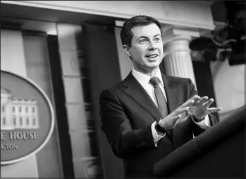  ?? SARAH SILBIGER / THE NEW YORK TIMES ?? Transporta­tion Secretary Pete Buttigieg briefs reporters Monday at the White House. Buttigieg and other members of President Joe Biden’s Cabinet will travel the country to promote infrastruc­ture investment­s in cities, towns, rural areas and tribal communitie­s.