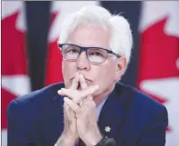  ?? CP PHOTO ?? Natural Resources Minister James Carr listens to questions at the National Press Theatre during a news conference in Ottawa on May 29.