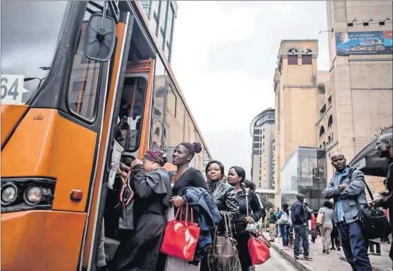  ?? Photo: Oupa Nkosi ?? Hey, big spenders: Some of money-lender Sebastian Mvundla’s clients give him a lift in their swanky cars and drop him off at the Putco bus stop in 5th Street, Sandton.