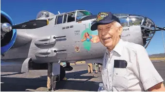  ?? JIM THOMPSON/JOURNAL ?? Bernie Armstrong, who flew fighter planes and is a veteran of World War II as well as the Korean and Vietnam wars, stands by the B-25 bomber “Maid in the Shade” at the Santa Fe Municipal Airport on Tuesday, before he was taken on a special flight for...