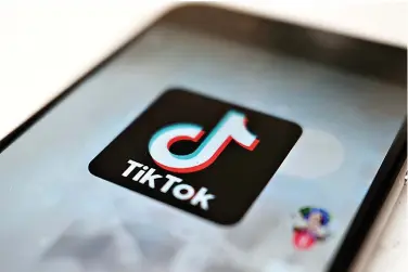  ?? (AP Photo/Kiichiro Sato, File) ?? FILE - The TikTok logo is displayed on a smartphone screen, Sept. 28, 2020, in Tokyo, Japan. The European Union is looking into whether TikTok has broken the bloc’s strict new digital rules for cleaning up social media and keeping internet users safe.