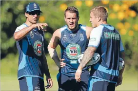  ?? Photo: GETTY IMAGES ?? Master plan: New South Wales coach Laurie Daley offers a guiding hand to his new halves combinatio­n Josh Reynolds and Trent Hodkinson, who face a huge task against Queensland’s star-studded lineup.