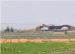  ?? — AFP ?? A view of the damaged Shayrat airfield at the Syrian government forces military base targeted by US Tomahawk cruise missiles.