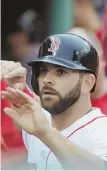  ?? STAFF PHOTO BY JOHN WILCOX ?? GIVE HIM A HAND: Mitch Moreland had three hits and three RBI for the Red Sox in last night’s victory.