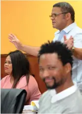  ??  ?? PBI Councillor Virgill Gericke (back, standing) asked for a detailed report on some of the financial statements. Seated are Ikhosa councillor Theresa Fortuin (left) and court interpreto­r Bonisile Desha.