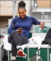  ?? CAMERON SPENCER / GETTY IMAGES ?? Serena Williams relaxes during a practice session ahead of the French Open at Roland Garros on Thursday in Paris.