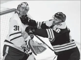  ?? CHARLES KRUPA/AP PHOTO ?? Boston’s David Krejci checks Toronto goaltender Frederik Andersen (31) during the second period of Game 7 of a Stanley Cup first-round playoff series on Wednesday at TD Garden.