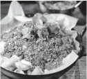  ??  ?? Keema fries are composed of ground brisket, mozzarella and white sauce.