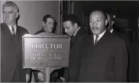  ?? Photograph: Bettmann Archive ?? Martin Luther King arriving at the FBI office to speak with its director, J Edgar Hoover, who had recently and publicly called the civil rights leader a ‘notorious liar’.