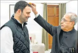  ?? PTI ?? ▪ Congress vice president Rahul Gandhi seeks blessings of former president Pranab Mukherjee before filing his nomination papers for the party chief’s post in New Delhi on Monday.