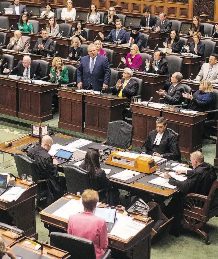  ?? CHRIS YOUNG / THE CANADIAN PRESS ?? Premier Doug Ford speaks in the Ontario Legislatur­e during an all-night session to debate a bill that would cut the size of Toronto city council from 47 representa­tives to 25.