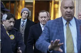  ?? AP PHOTO/ANDRES KUDACKI ?? Actor Kevin Spacey, center, leaves the Daniel Patrick Moynihan Court House on Thursday, Oct. 20, in New York. A jury sided with Kevin Spacey in one of the lawsuits that derailed the film star’s career, finding he did not sexually abuse Anthony Rapp, then 14, while both were relatively unknown actors in Broadway plays in the 1980s.