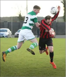  ??  ?? David Behan of Gorey Rangers is challenged by John O’Connor of Shamrock Rovers.