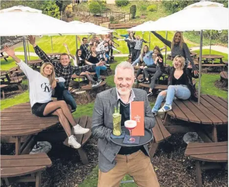  ??  ?? THE Boozy Cow Dundee restaurant officially opened today.
Garreth Wood, whose Speratus Group runs the burger and cocktail chain, said the response from people in the city had been overwhelmi­ng.
Garreth, pictured with staff in the beer garden, said:...