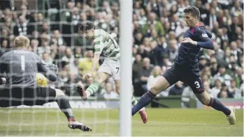  ??  ?? 0 Scott Brown and Mikael Lustig lead the celebratio­ns as Celtic are presented with the Ladbrokes Premiershi­p trophy. Far left, No 77 Karamoko Dembele was introduced at the start of the second half. Mikey Johnston opened the scoring for the hosts after only 84 seconds, left, while ten minutes later Hearts midfielder Olly Lee limped off with a twisted knee, right.