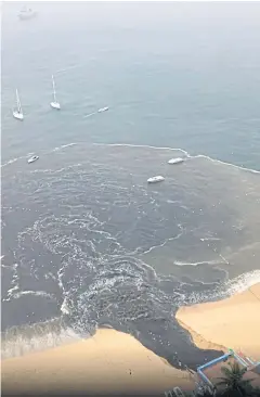  ?? REUTERS ?? ‘Black water’ flows into Acapulco Bay in Acapulco, Guerrero, Mexico on June 25 in this picture obtained from social media.