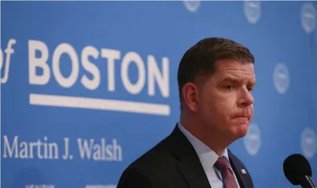  ?? Nancy lane pHoTos / Herald sTaff ?? D.C. BOUND: Mayor Martin Walsh is choked up as he speaks after being confirmed as Labor Secretary during his last press conference as mayor at Faneuil Hall on Monday. At top, Walsh waves as he exits.