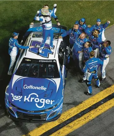  ?? SEAN GARDNER/GETTY ?? JTG Daugherty driver Ricky Stenhouse Jr., and his crew celebrate after winning the Daytona 500 on Sunday.