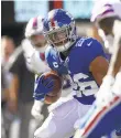  ?? SARAH STIER/GETTY ?? The Giants’ Saquon Barkley carries the ball during the third quarter Sunday against the Bills.