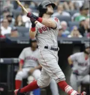  ?? FRANK FRANKLIN II — AP PHOTO ?? Boston Red Sox’s Andrew Benintendi follows through on a three-run home run during the fifth inning of a baseball game against the New York Yankees on Saturday in New York.