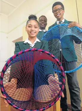  ?? Picture: TREMAINE VAN AARDT ?? BRIGHT IDEAS: Paterson High School pupils, from left, Kirsty Langford, 16, Collin Chaipa, 16, and Mandilakhe Gqolana, 17, show off their creations. They are just some of the pupils who competed at the recently held regional Eskom Expo for Young Scientists competitio­n