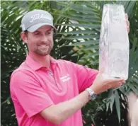  ?? The Associated Press ?? BIG WIN: Webb Simpson accepts the The Players Championsh­ip trophy Sunday in Ponte Vedra Beach, Fla.