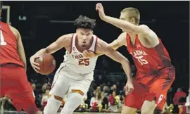  ?? Gina Ferazzi Los Angeles Times ?? USC’S BENNIE BOATWRIGHT drives against Oklahoma’s Brady Manek during the Sooners’ victory. Boatwright had 10 points but made only three of 13 shots.