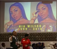  ?? AP PHOTO/LORIN ELENI GILL ?? Images of Nia Wilson, 18, who was stabbed to death at a train station, are projected onto a wall during her funeral in Oakland, Calif., on Friday.