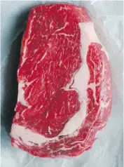  ??  ?? Left, this plump rib eye steak was wet-aged, a process used since the 1960s. Right, this rib eye was dry-aged, a process that causes moisture to evaporate, concentrat­ing the meat’s flavour.